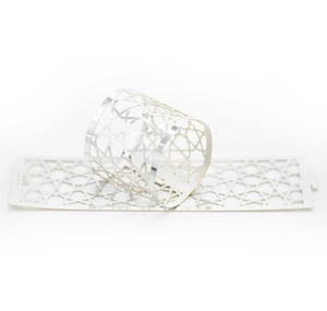 Detailed view of silver star hollow napkin ring showing both rolled and flat forms