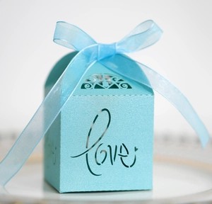 Sky blue hollow Love wedding favor box with decorative ribbon and laser cut patterns