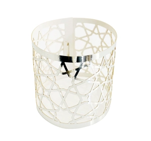 Macro detail of silver geometric cutout napkin ring with intricate octagonal star pattern