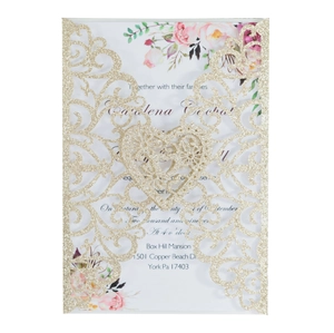 Detail of laser-cut champagne gold glitter wedding invitation with floral insert