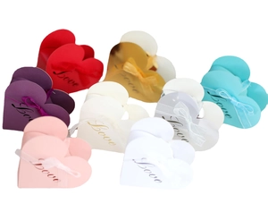 Pink heart-shaped candy boxes with Love text and ribbons for weddings and Valentine's Day