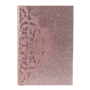 Detail of rose gold laser-cut rose floral lace on glitter paper wedding invitation
