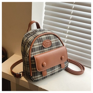 Detail of vintage mini checkered backpack with leather trim and gold metal zipper