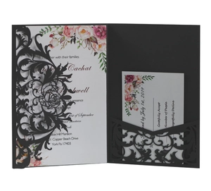 Laser cut black wedding invitation set with floral cards and intricate rose patterns