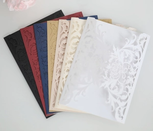 Detailed laser-cut rose invitations shown in a variety of elegant multi-color paper options