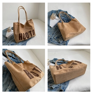 Multiple views of a large brown suede tote bag with HOOTO embroidery and metal rivets