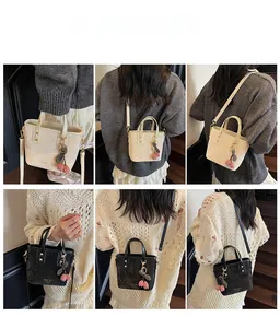 Mini tote bag in beige and black shown as handbag, shoulder bag, and crossbody style