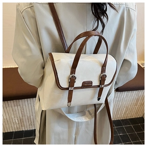 British retro two-tone backpack featuring contrast shoulder straps and fashion label detail