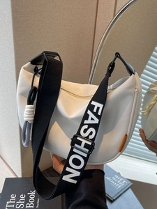 White nylon crescent crossbody bag with wide FASHION letter strap and orange label