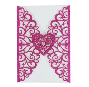 Detailed laser-cut glitter pink wedding invitation card with intricate vine patterns and heart