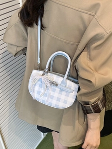 Blue and white checkered bucket bag with pearl pendant and light blue shoulder strap