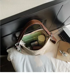 Top view of large canvas tote bag showing spacious interior with tablet and daily items