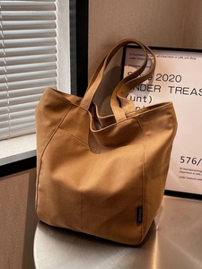 Caramel brown canvas tote bag with large capacity and minimalist design for women