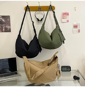 Nylon dumpling bags in black, green, and khaki with matching small zippered pouches