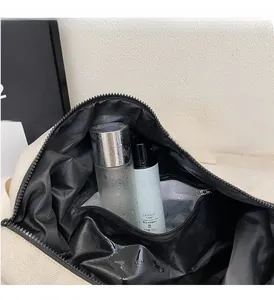 Detail of travel bag waterproof interior compartment with wet and dry separation feature