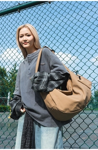 Close-up of khaki crescent hobo bag made of durable nylon fabric for daily use