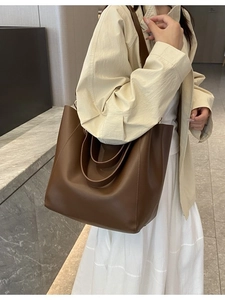Classic dark brown tote bag with dual handles and long shoulder strap for women