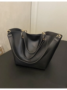 Classic black leather tote bag with gold metal buckles and dual handles for women