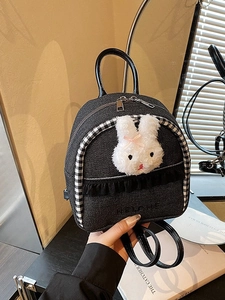 Mini denim backpack featuring a plush bunny and monochrome checkered ruffles detail