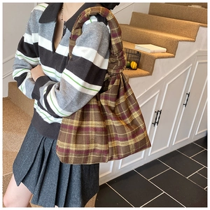 Brown plaid tote bag featuring a retro knotted shoulder strap and thick woven fabric texture