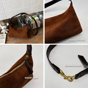 Detailed views of dark brown suede dumpling bag with vintage hardware and zipper