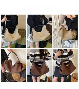 Detail showing checkered hobo bag worn as a shoulder and crossbody bag by a model