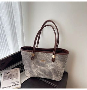 Detailed macro shot of the Jingpin logo and marble texture on this large tote bag