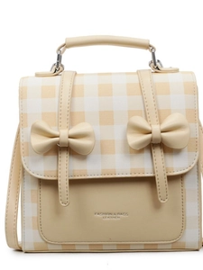 Mini zaino in percalle giallo con fiocchi in pelle e spalline regolabili da donna