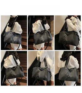 Versatile black travel bag shown in various carrying styles and angles on a model