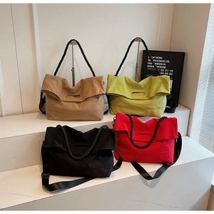 Detailed arrangement of colorful canvas tote bags with thick rope handles and nylon straps