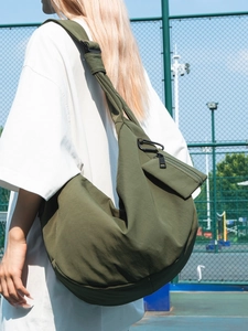 Olive green nylon hobo bag for women with wide adjustable strap and small side pouch