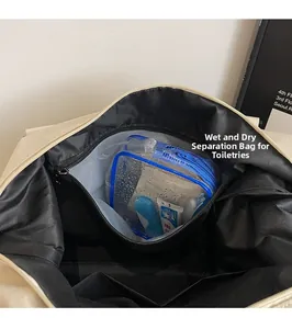 Detail view of transparent PVC dry-wet separation pocket for toiletries in travel bag