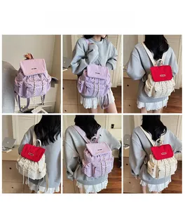 Detail view of large capacity nylon backpack with drawstring closure and multiple pockets