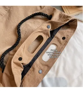 Close-up of nylon tote bag with strong magnetic clasp closure and thick rope handle