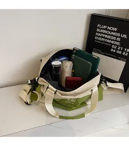 Spacious interior of travel bag showing tablet, wallet, and water bottle storage