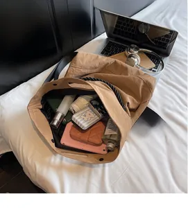 Internal view of brown nylon tote bag showing spacious capacity for tablets and essentials