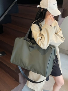 Olive green high-capacity Oxford fabric handbag with adjustable shoulder strap for travel