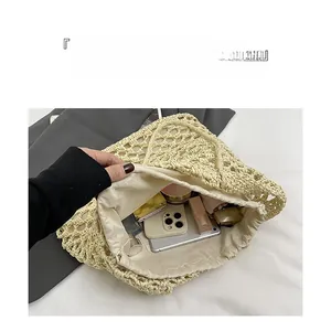Detail view of large capacity hollow woven beach tote bag with drawstring lining storage