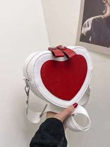 Fashionable heart-shaped crossbody bag in white and red faux leather with wide strap