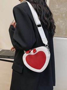 Fashionable heart-shaped crossbody bag with red and white contrast and wide strap