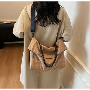 Detail of camel large capacity tote bag with wide strap and braided handle