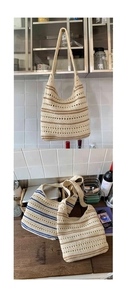 Detail of handmade crocheted cotton shoulder bag with striped texture and hollow design