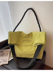 Modern mustard yellow large tote bag with wide strap and black woven handles