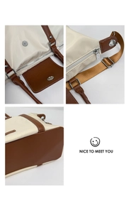 Detailed view of durable metal zippers and magnetic closure on the nylon tote bag