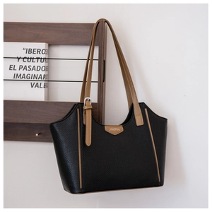 Detail of black mesh tote bag with brown straps and golden JINGPIN logo on top