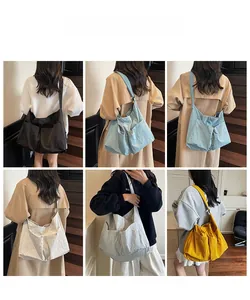 Multi-color large capacity tote bags with front pockets shown on models in indoor setting