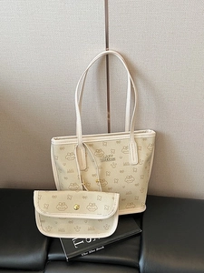 Chic beige tote bag set with cute cartoon prints and shoulder straps for daily commute