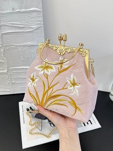 Pink embroidered lily canvas bag with vintage metal frame and gold chain strap