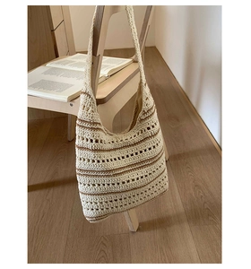 Detail of crochet cotton rope tote showing striped weave and hollow out pattern texture