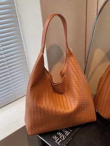 Retro caramel woven leather tote bag with a hobo silhouette for chic daily commuting